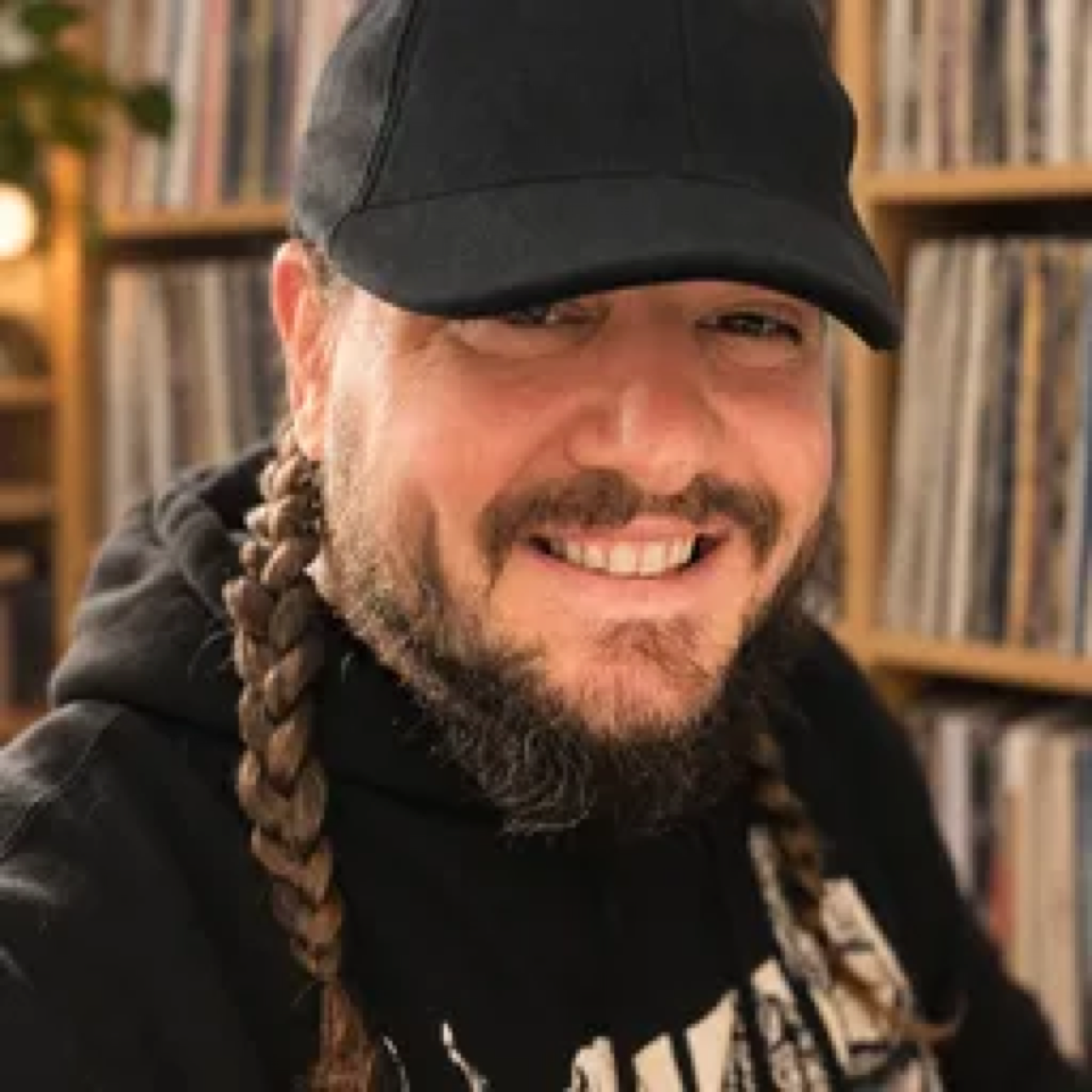 Bear Cole in front of shelves of records